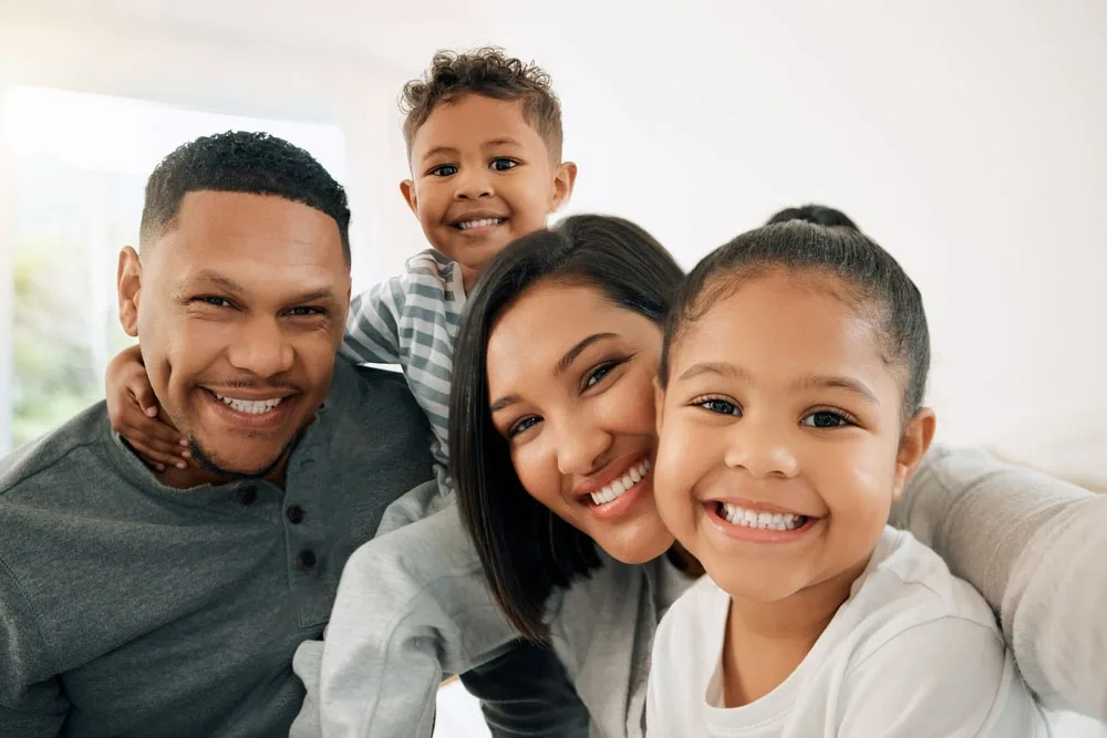 Smiling family at an orthodontic consultation